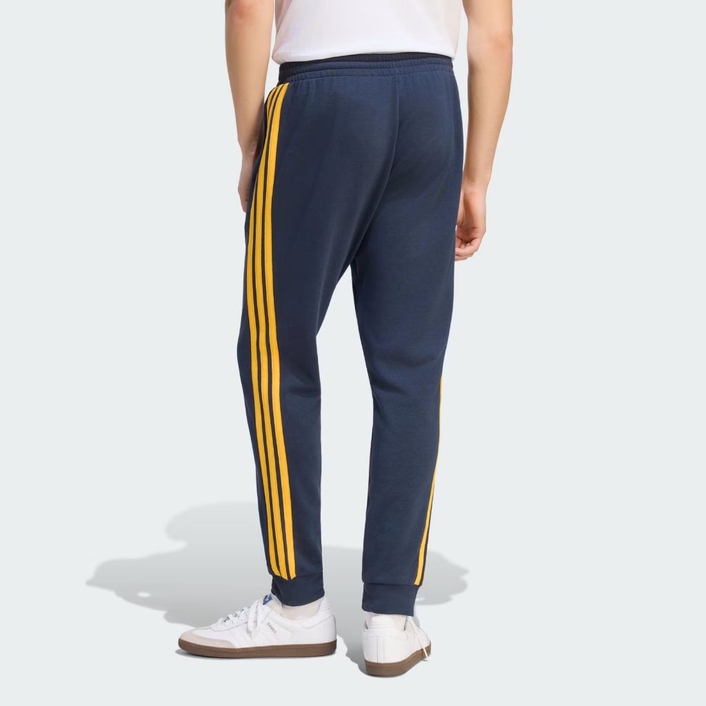 Pantaloni Adidas Real Madrid blu navy con bande gialle e polsino