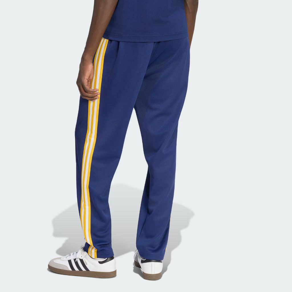 Pantaloni Adidas Originals Real Madrid blu navy con bande gialle laterali