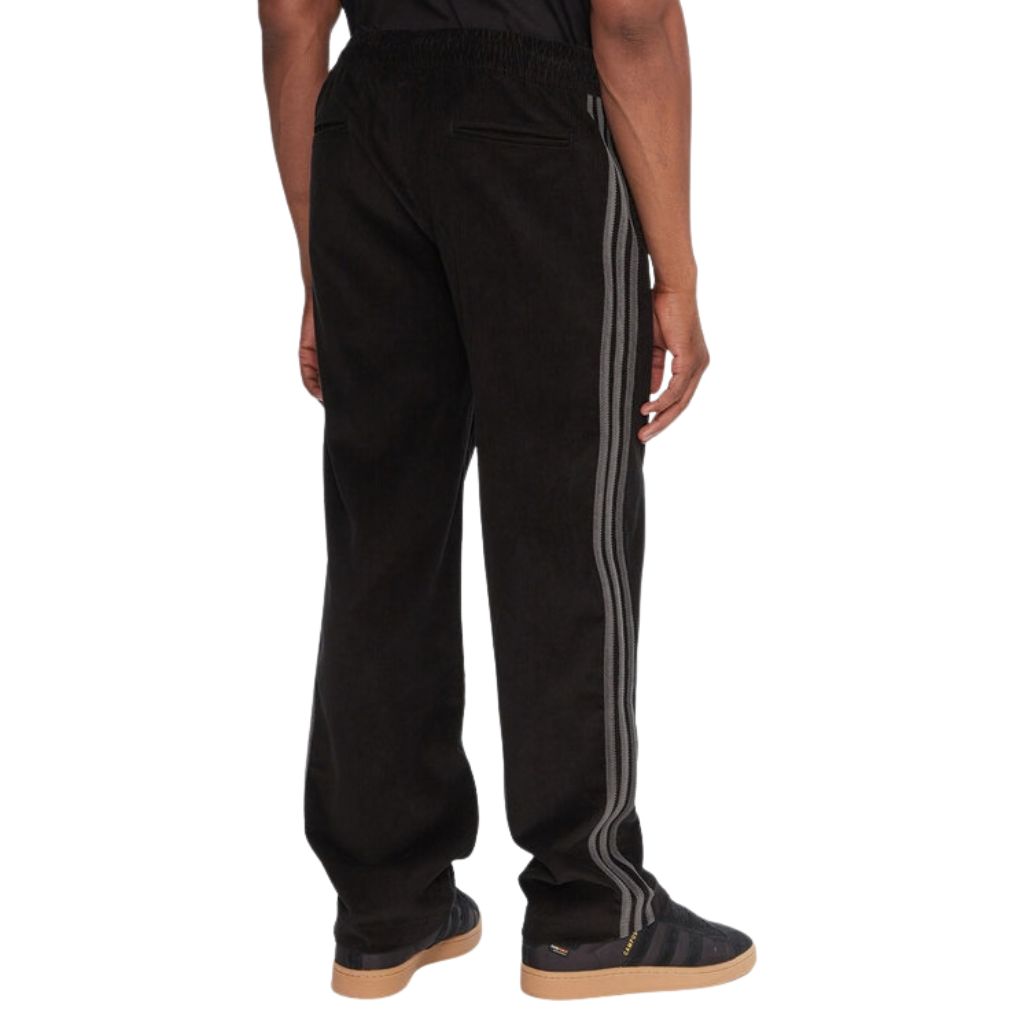 Pantaloni Adidas neri in velluto a coste con bande grigie laterali