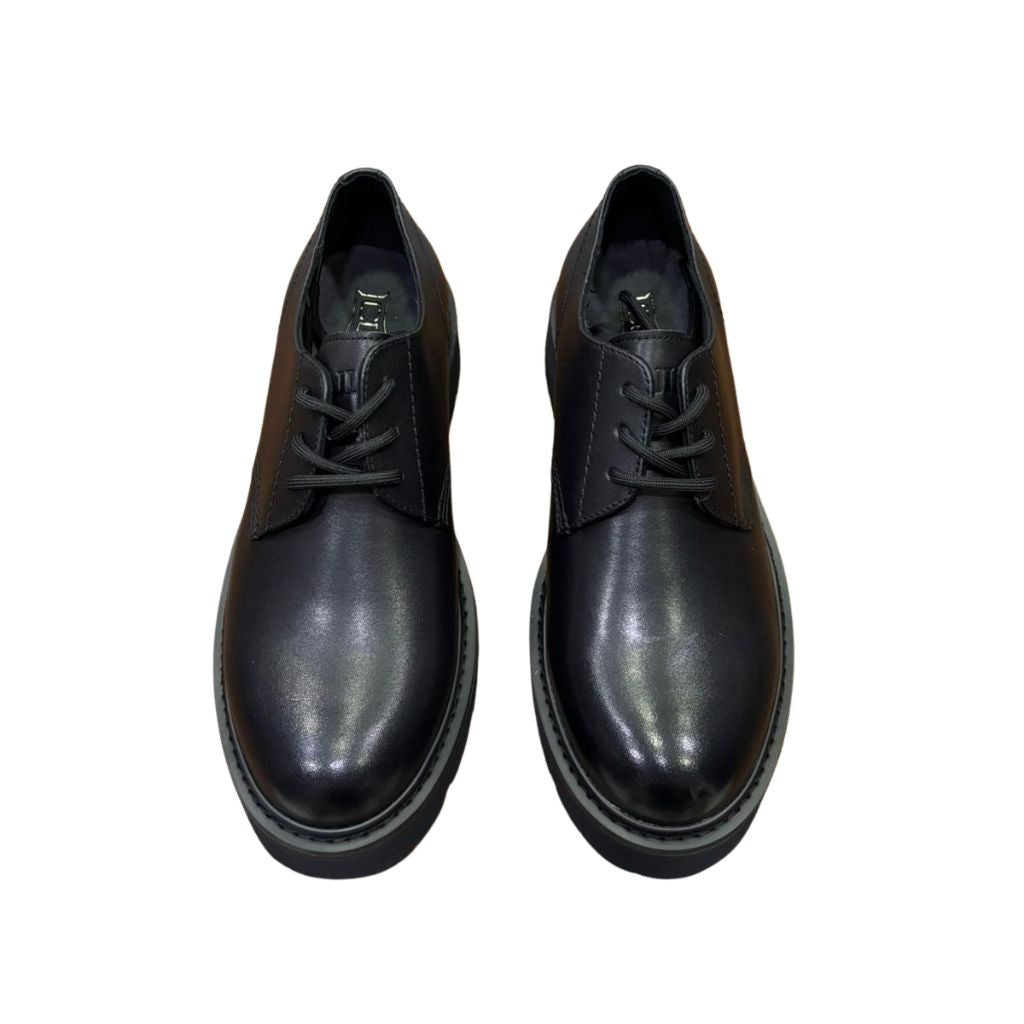 Derby Cult nera in pelle con suola platform