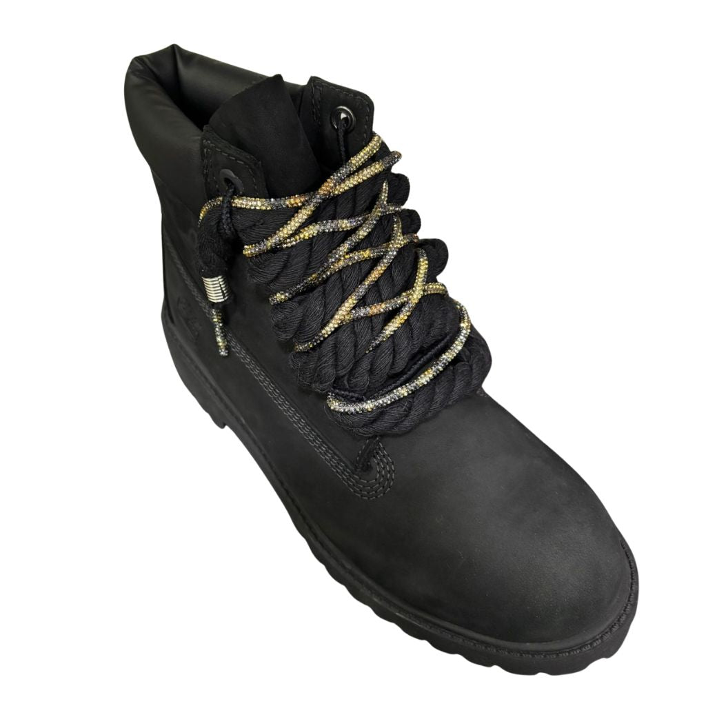 Stivale Timberland in nubuck nero con lacci a corda neri e laccio glitter.