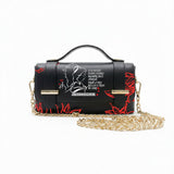 Borsa Alviero Rodriguez Chery Best Heart con un disegno a linee bianche e foglie rosse su fondo nero
