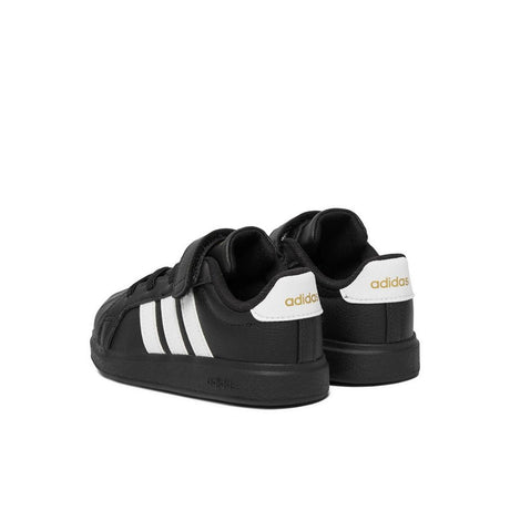 Sneakers adidas nere da bambino con tre strisce bianche e strappo