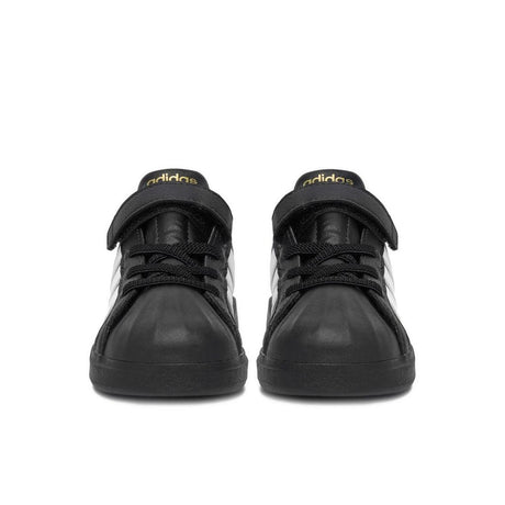Sneakers adidas nere da bambino con tre strisce bianche e strappo