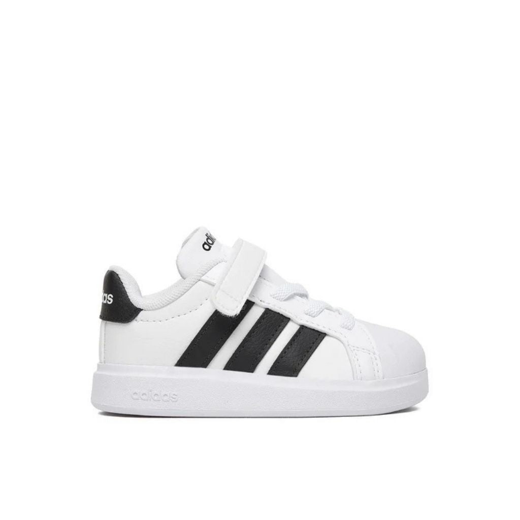 Sneakers adidas bianche da bambino con tre strisce nere e strappo