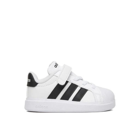 Sneakers adidas bianche da bambino con tre strisce nere e strappo