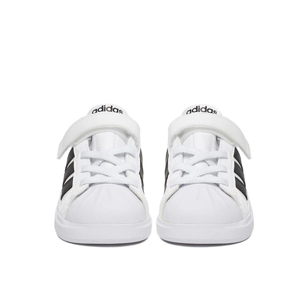 Sneakers adidas bianche da bambino con tre strisce nere e strappo