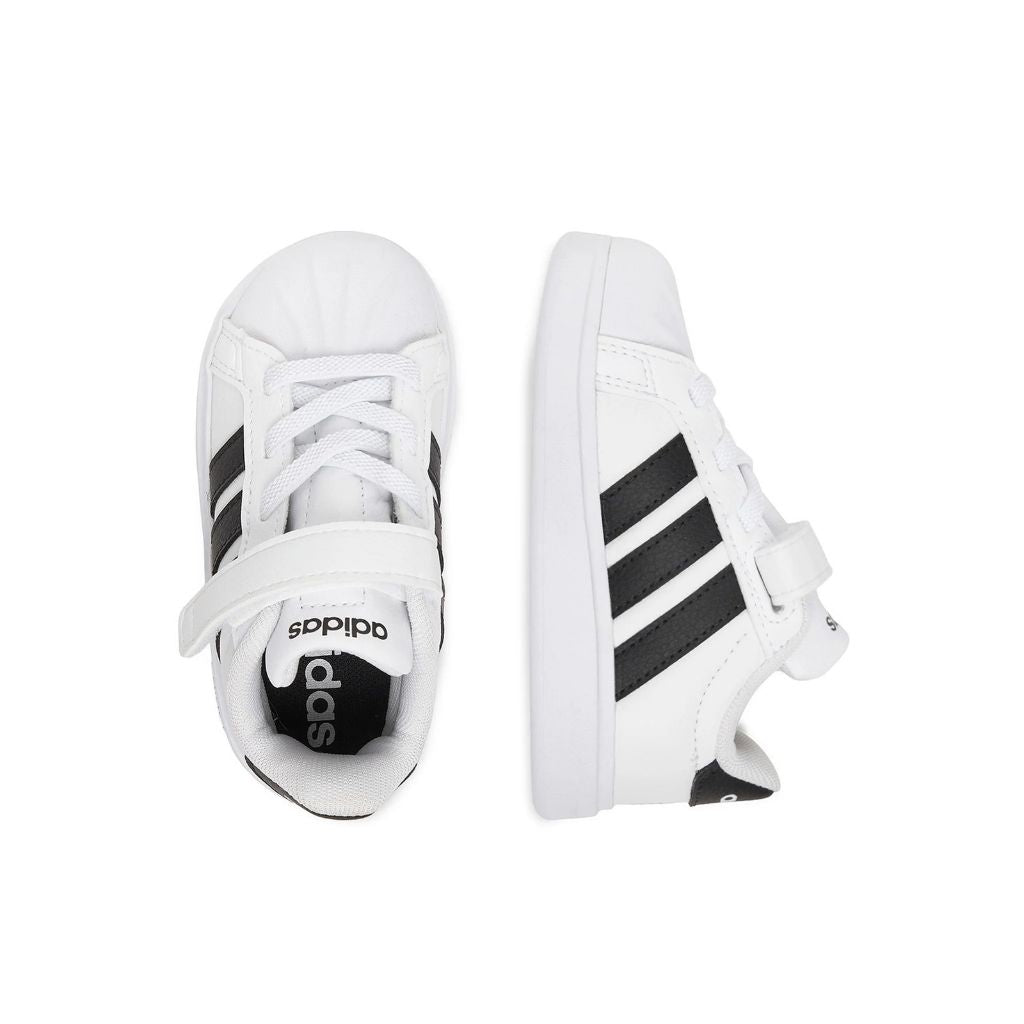 Sneakers adidas bianche da bambino con tre strisce nere e strappo