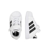 Sneakers adidas bianche da bambino con tre strisce nere e strappo