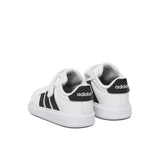 Sneakers adidas bianche da bambino con tre strisce nere e strappo