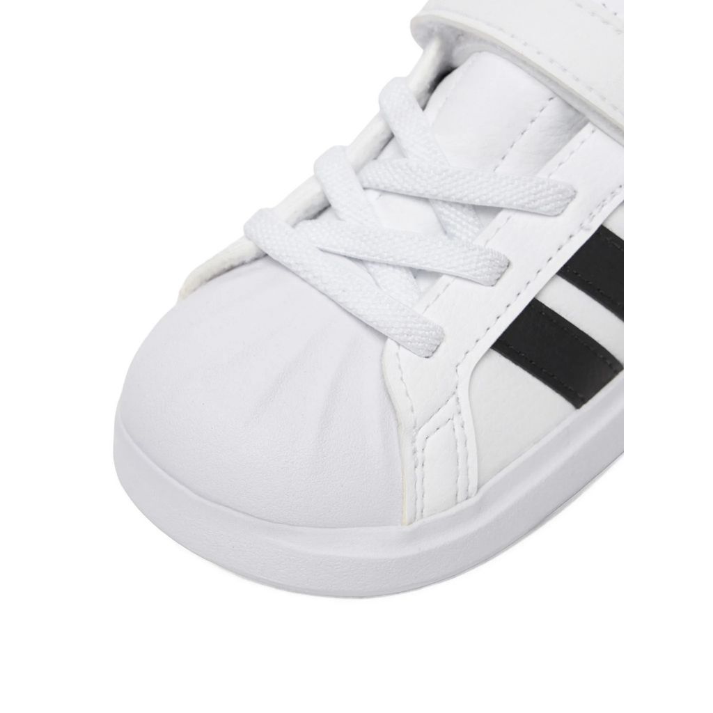 Sneakers adidas bianche da bambino con tre strisce nere e strappo