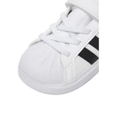 Sneakers adidas bianche da bambino con tre strisce nere e strappo