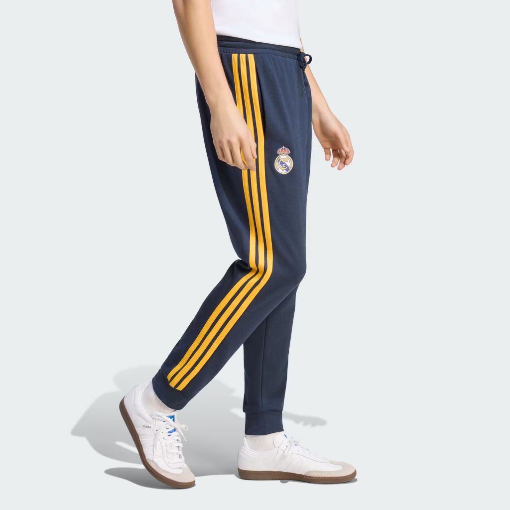Pantaloni Adidas Real Madrid blu navy con bande gialle e polsino