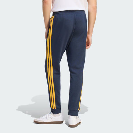 Pantaloni Adidas Real Madrid blu navy con bande gialle e polsino