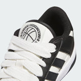 Sneaker adidas Rapid Court Low bianca e nera