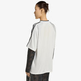 Maglia adidas Originals bianca con scollo a V, tre strisce nere e maniche lunghe in rete