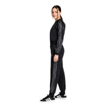 Tuta Adidas nera con giacca bomber corta e pantaloni con bande grigie