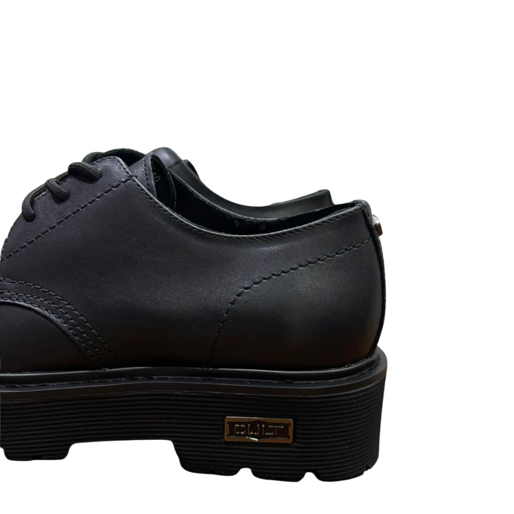 Derby Cult nera in pelle con suola platform