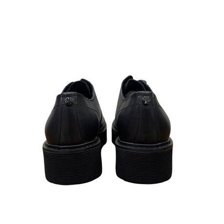 Derby Cult nera in pelle con suola platform