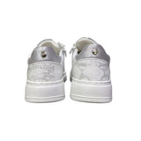 Sneakers da bambina bianche brand Cult in ecopelle, con dettaglio tallone pitonato, inserti argento e cerniera laterale interna per una calzata facilitata.