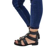 Sandalo gladiator Gagliotta in pelle nera, borchie piramidali argentate, chiusura zip.