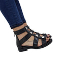 Sandalo gladiator Gagliotta in pelle nera, borchie piramidali argentate, chiusura zip.