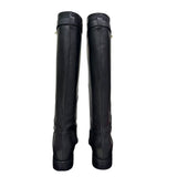 Stivale in pelle nera con rialzo interno 8 cm e cintura estraibile con accessorio oro.