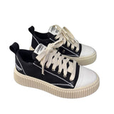 Sneaker Jammers London in canvas nero, punta bianca, suola platform 5 cm.