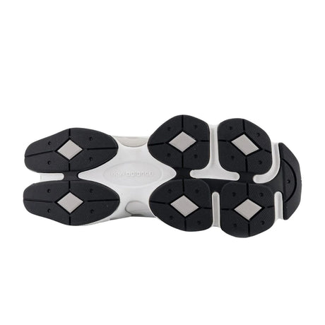 Sneaker New Balance 9060 bianca con tomaia in mesh e materiale gommato, intersuola ammortizzata ABZORB e iconico logo "N" laterale.