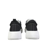 Sneaker uomo Unsolved tela nera cap toe bianco