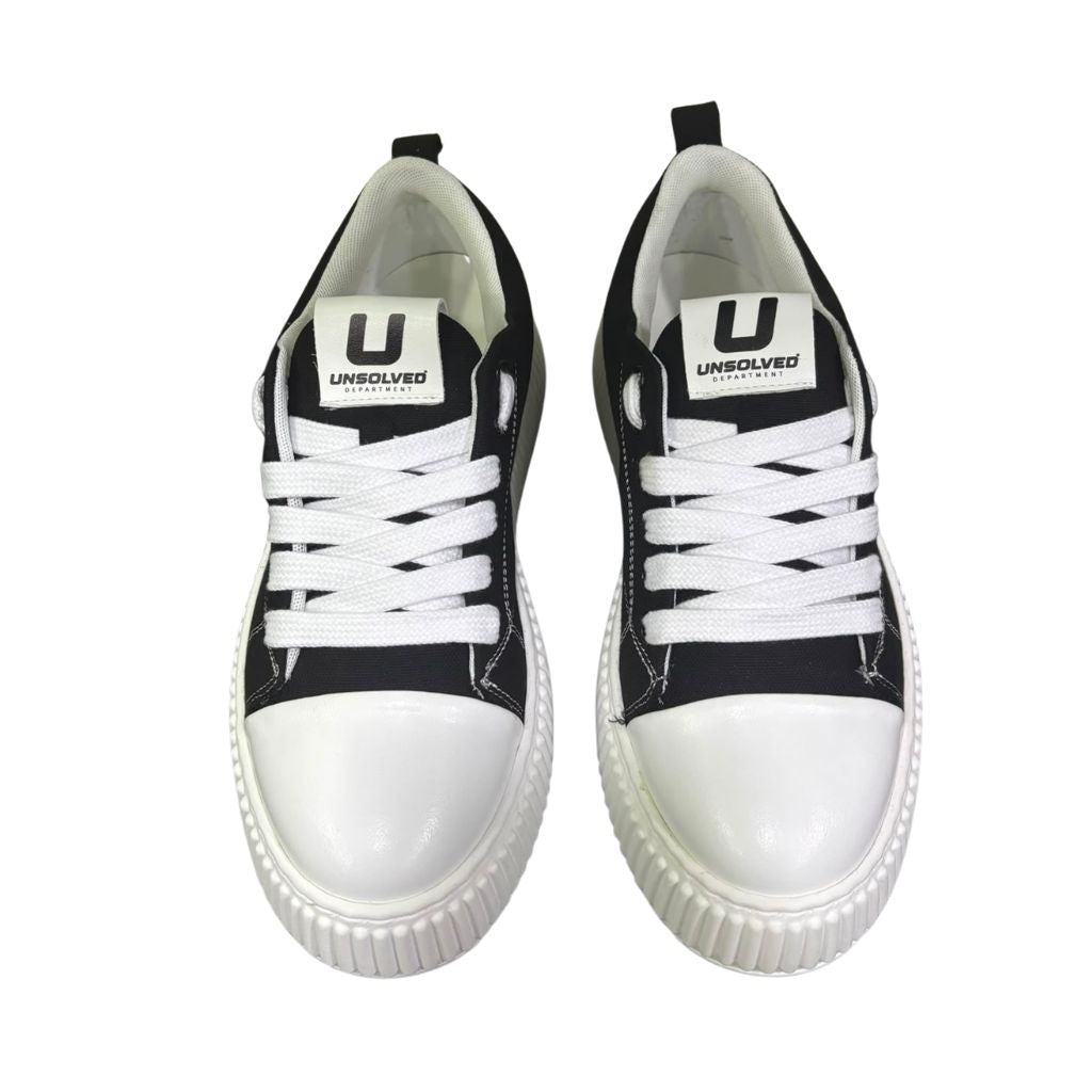 Sneaker uomo Unsolved tela nera cap toe bianco