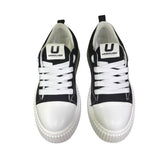 Sneaker uomo Unsolved tela nera cap toe bianco