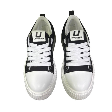 Sneaker uomo Unsolved tela nera cap toe bianco