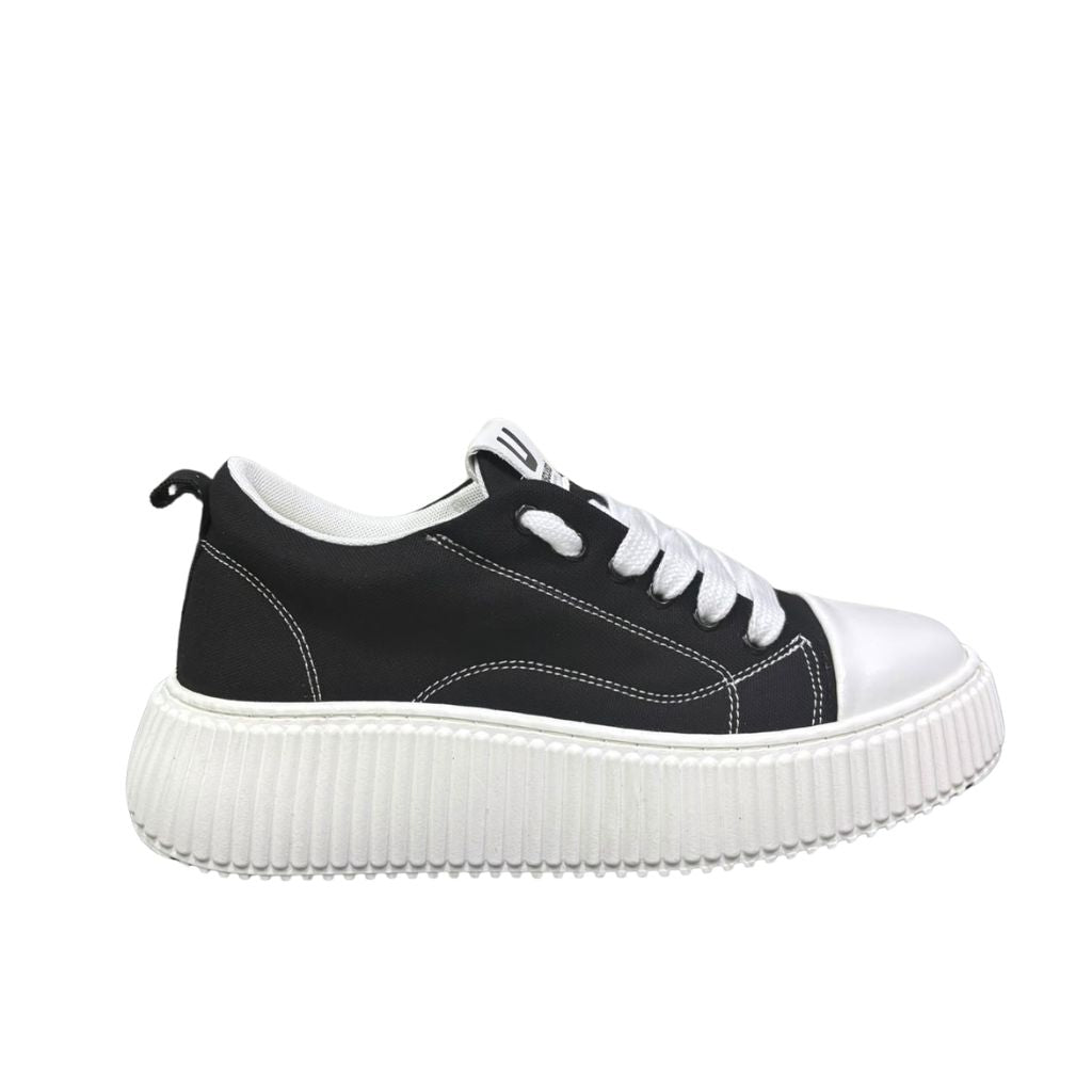 Sneaker uomo Unsolved tela nera cap toe bianco
